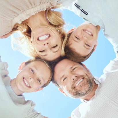Everyone knows about the circle of life. Low angle shot of a family of four standing in a huddle